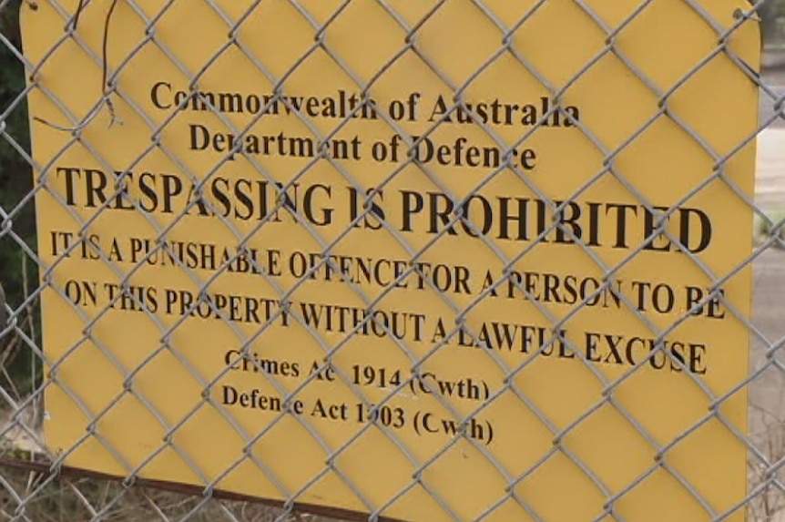 A no trespassing sign on Defence land
