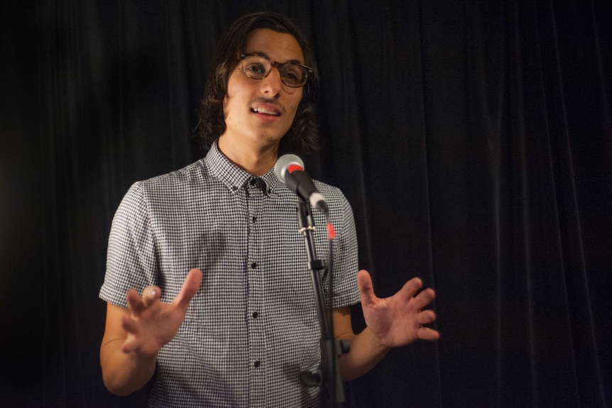 Poet Jason Marsiglia is expressive as he performs a work