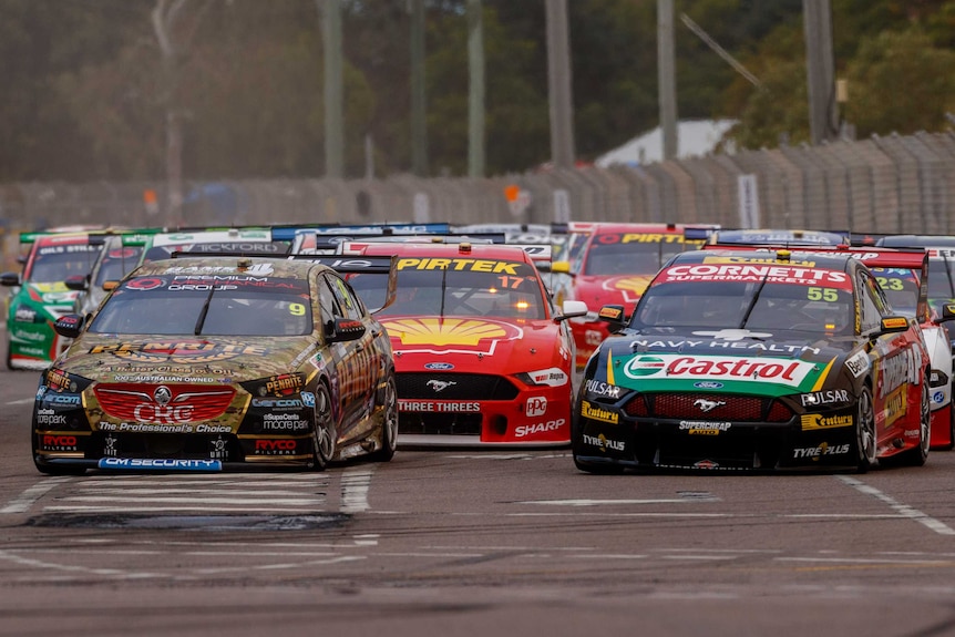 A a tightly packed group of supercars on the Townsville track