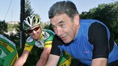 Cycling legend and five-time Tour winner Eddy Merckx (r) rides with Floyd Landis on rest day