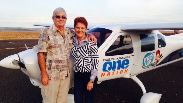 Brian and Pauline stand by a small aircraft.