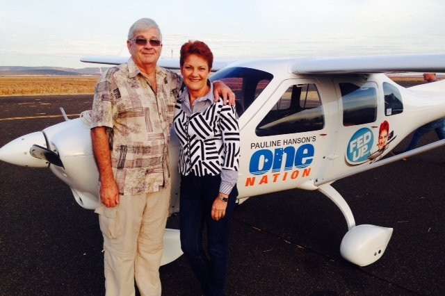 Brian and Pauline stand by a small aircraft.