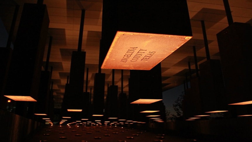 Rectangular slabs hanging from the ceiling at the National Memorial for Peace and Justice.