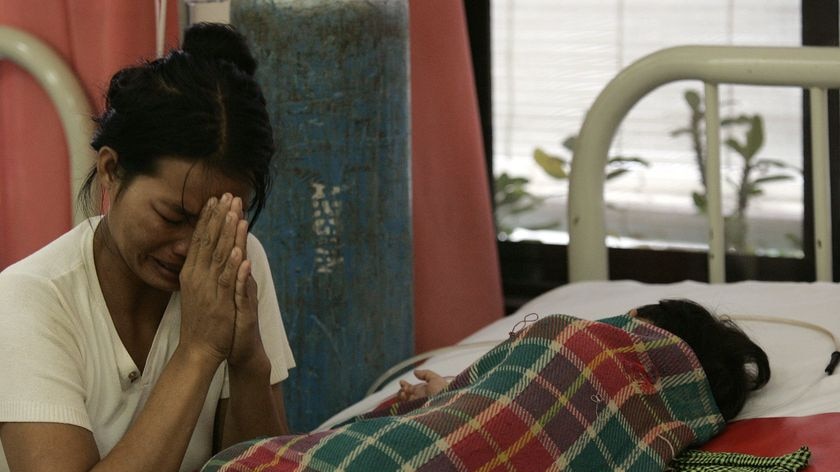 Cambodian mother and sick child in hospital