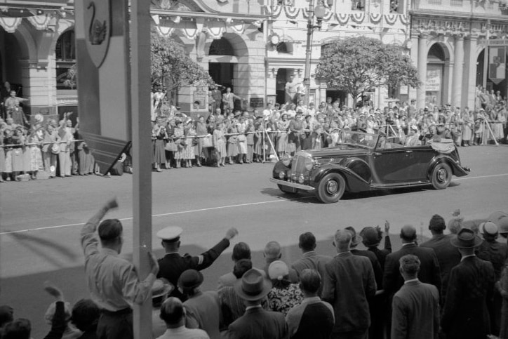 Crowds, including ABC staff, cheered on the royal car on St George's Terrace during the Queen's tour in 1954.