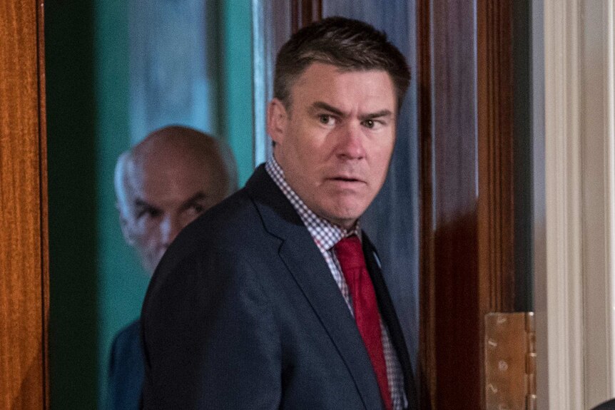 White House communications director Mike Dubke turns around looking slightly frightened in the East Room of the White House.