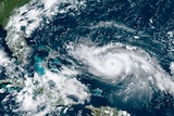 A satelite image shows a hurricane approaching the Florida coast while moving through Caribbean waters