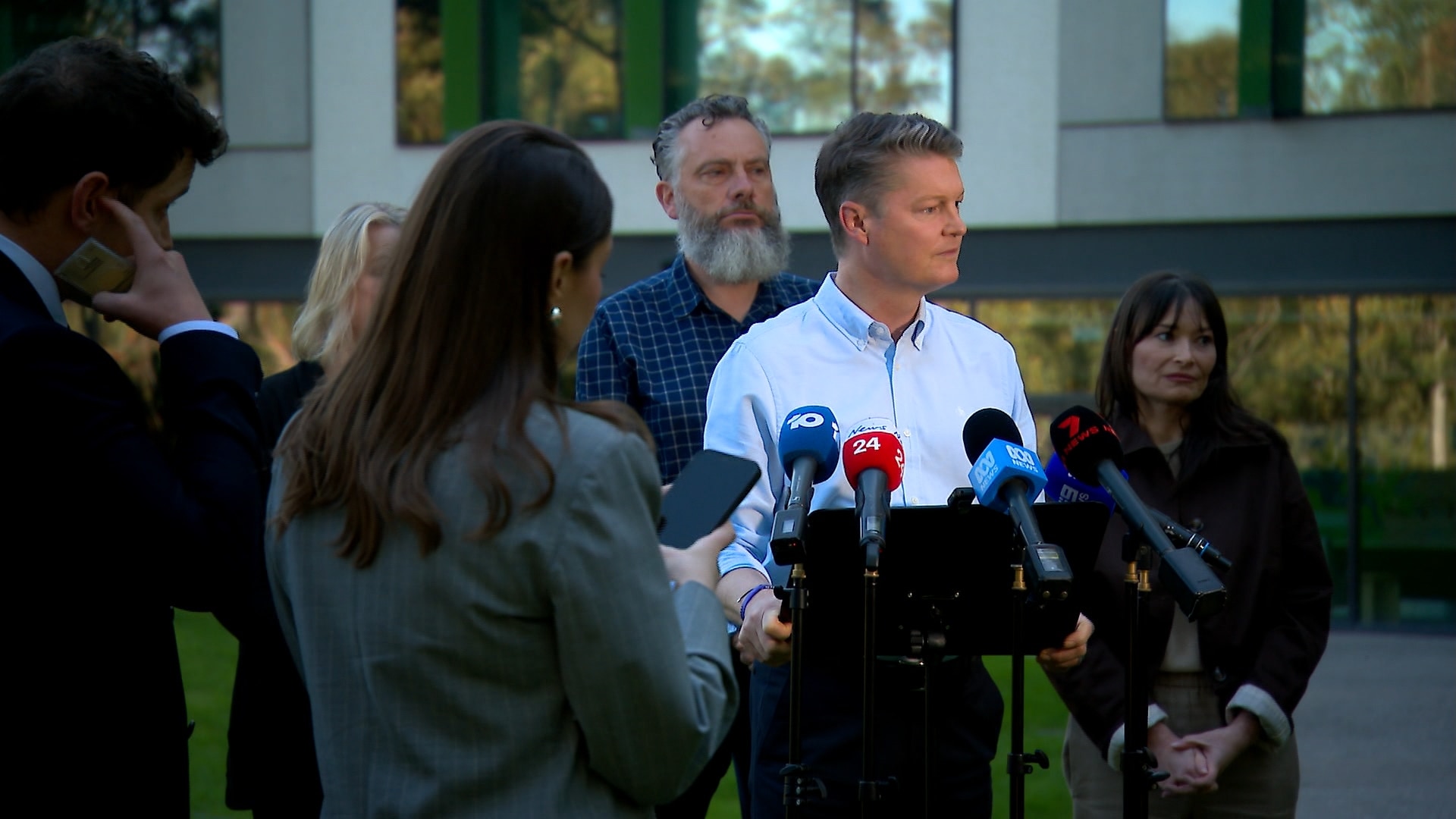 Ben Carroll addresses the media with wife Fiona by his side.