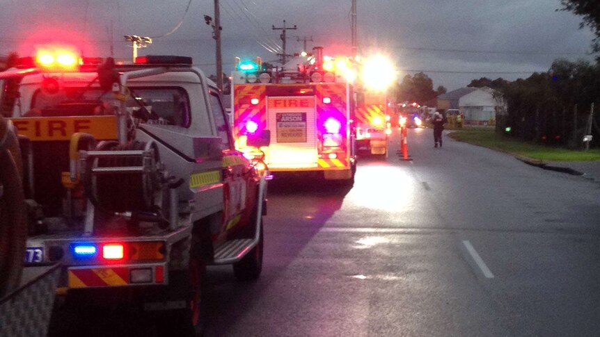 Line of fire trucks at fire in Bayswater tyre yard