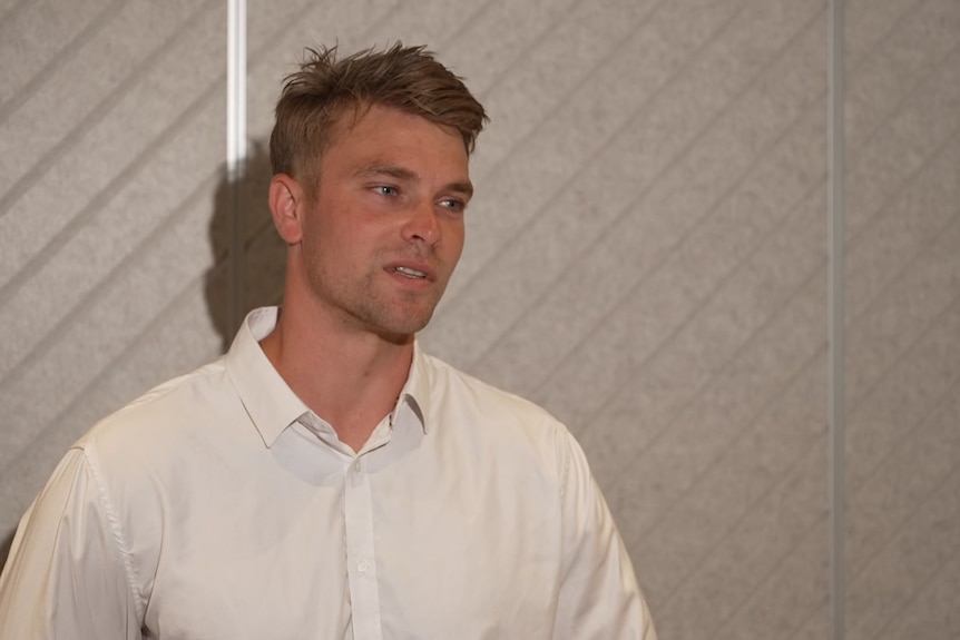 A man looking at the camera  A man looking at the camera