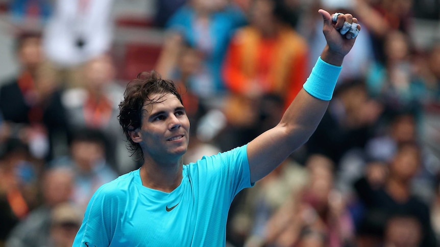 Spain's Rafael Nadal celebrates winning against Italy's Fabio Fognini at the China Open.