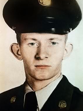A young Charles Robert Jenkins stares at the camera in his US military uniform.