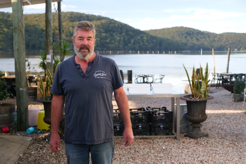 Man stands infront of the river