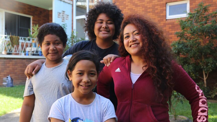 Siale Hausia with her three kids Vaohoi, 8 (front), Ta’a, 11 (left) and Lotu, 13 (back).