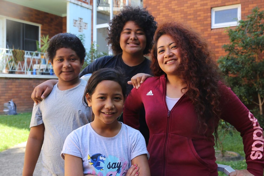 Siale Hausia with her three kids Vaohoi, 8 (front), Ta’a, 11 (left) and Lotu, 13 (back).