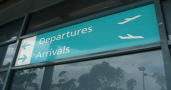Airport arrivals and departures sign.