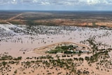 An aerial view of a flooded outback cattle station.