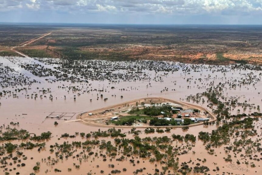 An aerial view of a flooded outback cattle station.