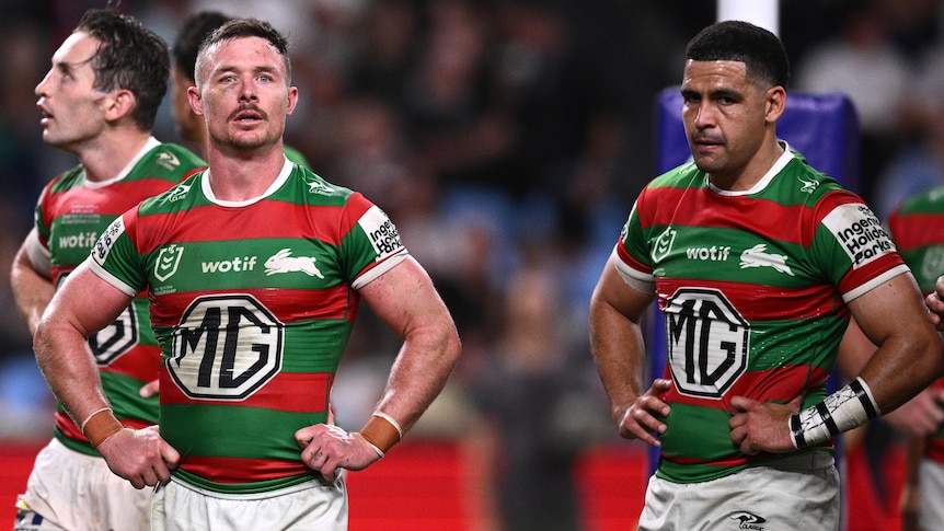Three Rabbitohs NRL players look dejected during loss to Sydney Roosters.