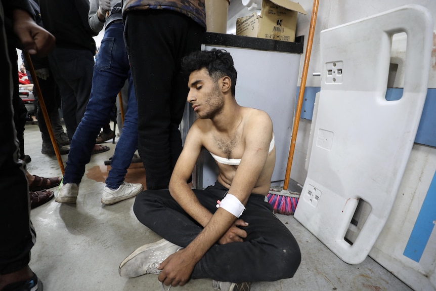 An injured man receives treatment in Gaza City's Al-Shifa hospital. 