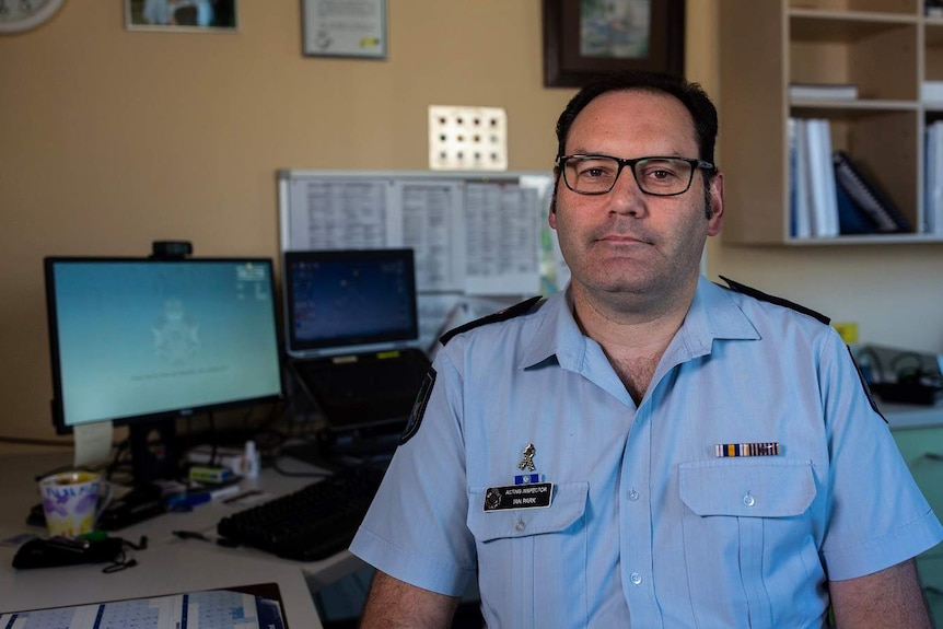 Inspector Ian Park sits in his office at Fortitude Valley Police Station.