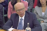 TV still of Rupert Murdoch at parliamentary inquiry into News of the World phone hacking