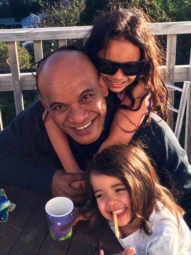 Roland Kun with his daughters