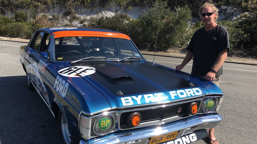 Michael Rystenberg standing in front of his 1970 GTHO Phase II Ford Falcon.