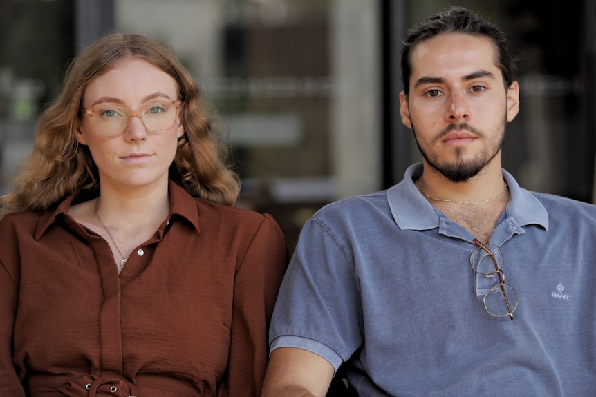 A young couple staring down the barrel 