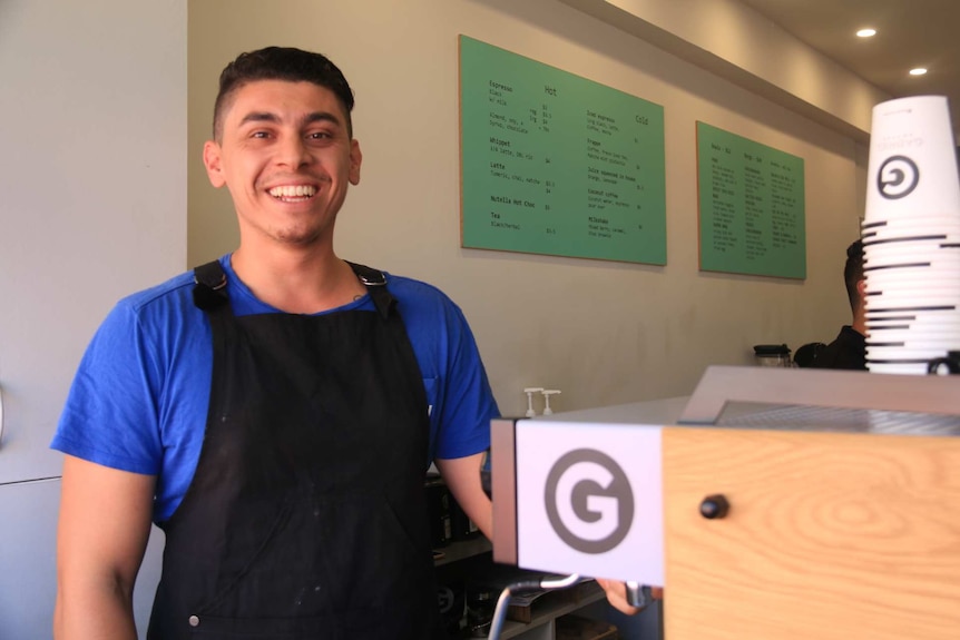 A young man in a cafe.