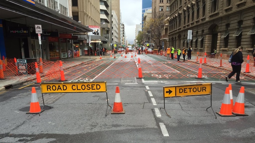 Road closure signs after flooding.