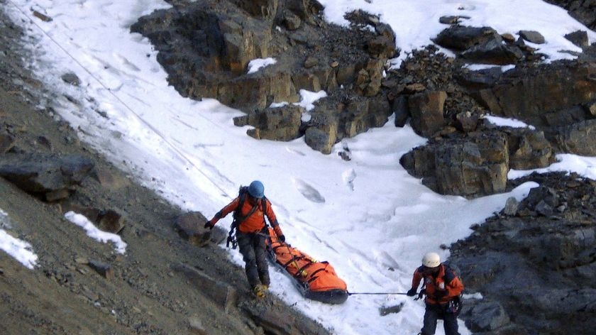 Bolivian rescue team carries the body of Australian climber Peter Cornelius Wiesenekker