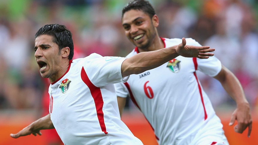 Hamza al Daradreh of Jordan celebrates scoring a goal during the 2015 Asian Cup