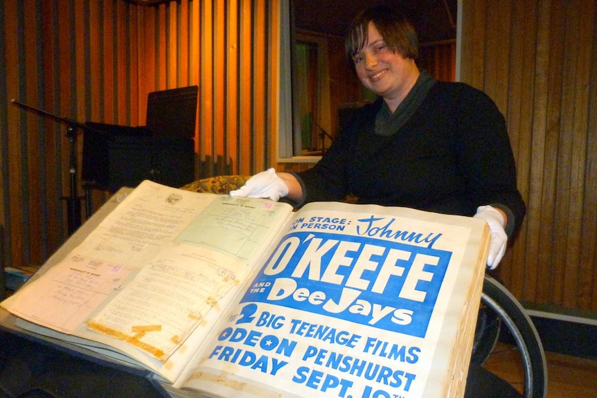 NFSA archivist Tamara Osicka with a Johnny O'Keefe scrapbook