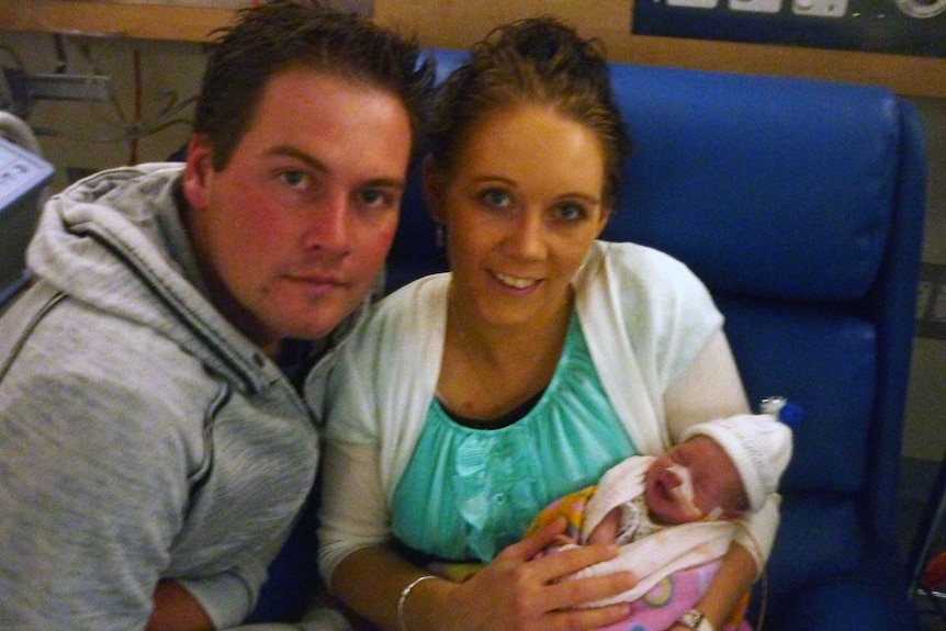 Peyton Drinkwater with her parents after she was born prematurely.