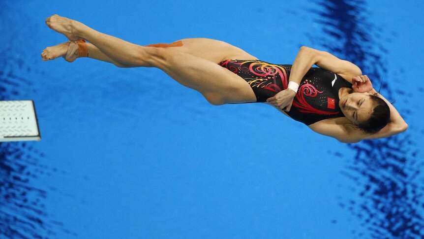 China's Wu Minxia performs a dive during the women's 3m springboard final