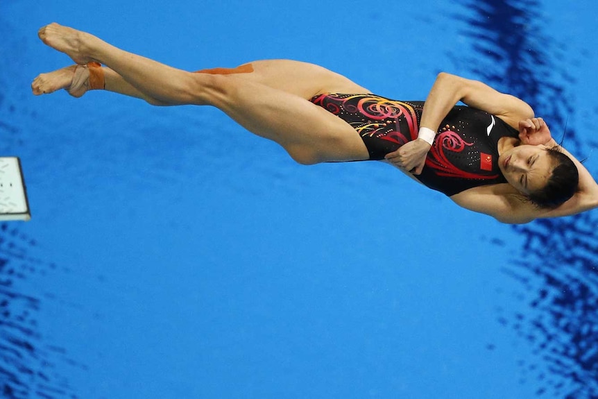 China's Wu Minxia performs a dive during the women's 3m springboard final