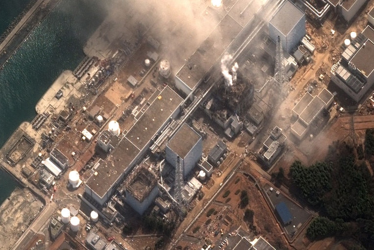 Smoke rising from the earthquake and tsunami damaged Fukushima no. 1 nuclear plant in Japan.