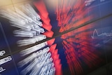 A slow shutter photograph showing a blurry market trading board at the Australia Securities Exchange.
