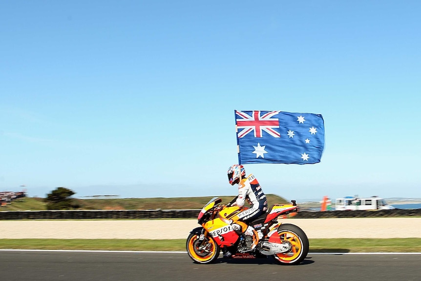 Casey Stoner celebrates after winning his sixth consecutive Australian MotoGP at Phillip Island.