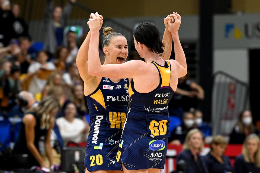 Mahalia Cassidy and Kate Walsh embrace after a win against the Vixens