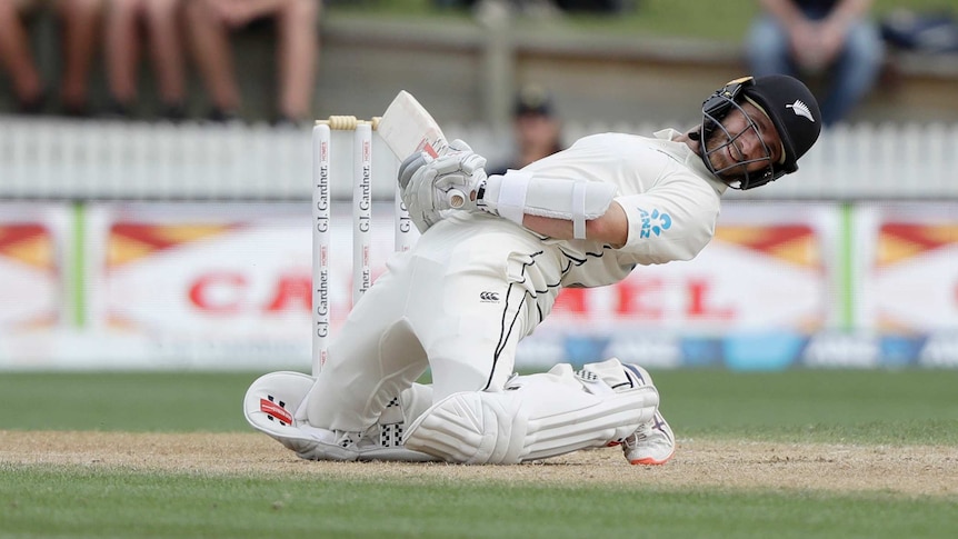 Kane Williamson gets down on his haunches and leans back to evade a short delivery