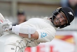 Kane Williamson gets down on his haunches and leans back to evade a short delivery