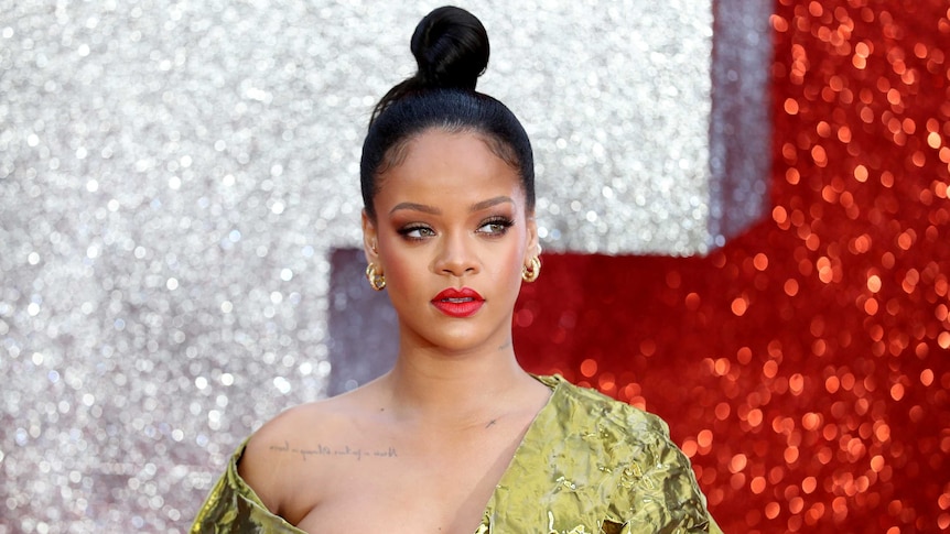 Rihanna's face as she walks on the red carpet, representing Fenty: her beauty products that are inclusive of people of colour.