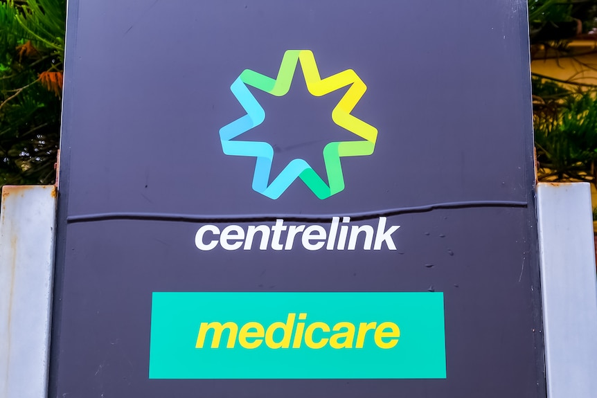 A sign displaying the centrelink and medicare logos.