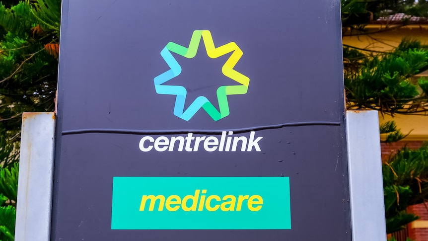 A sign displaying the centrelink and medicare logos.