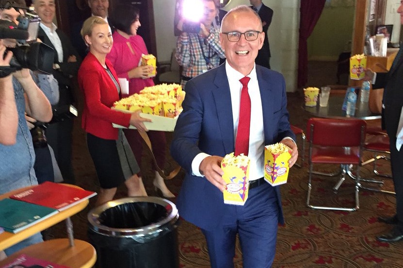 SA Premier Jay Weatherill carrying popcorn.