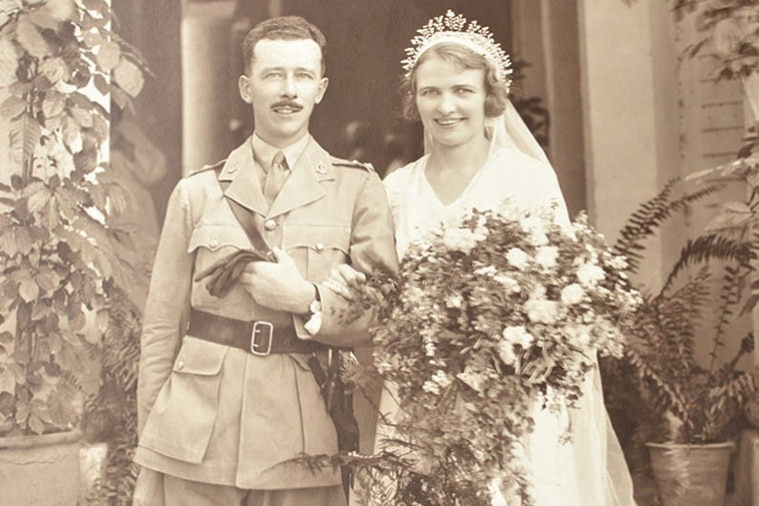 A black and white wedding photo of a couple.