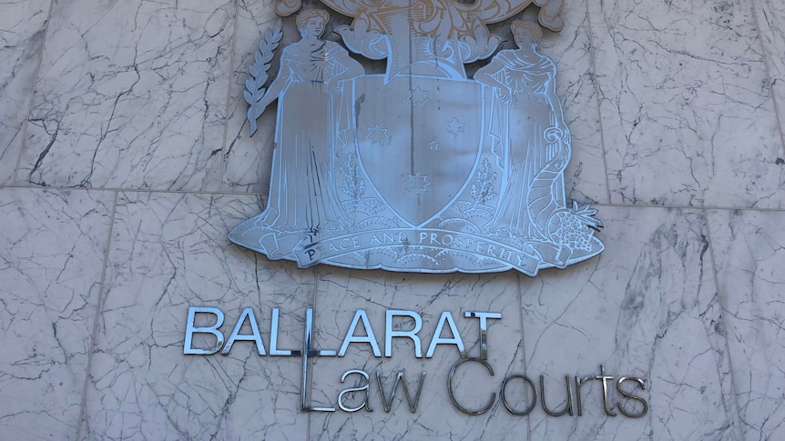 A shiny metal sign reading Ballarat Court.