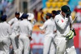 Peter Handscomb leaves the field in distress after being dismissed for 18.